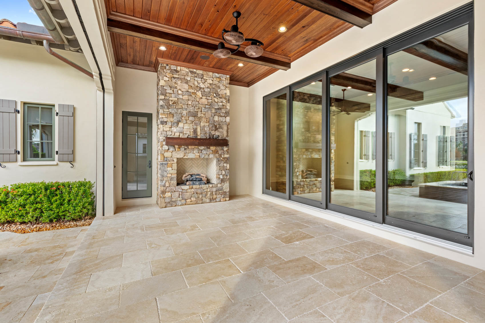 covered back patio with fireplace